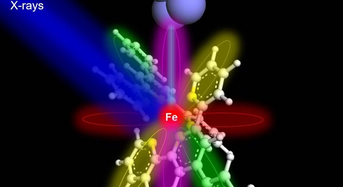 An atomic structure struck by a blue line labeled X-rays and a beam from a cluster of purple balls labeled tip.